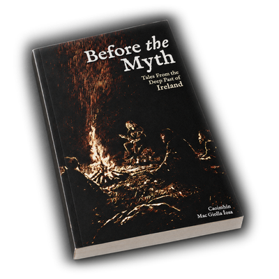 The paperback of Before the Myth standing on the studio ground, the firelit cover facing out.