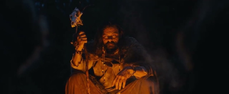 A firelit seer holding a staff crowned with an animal skull; a still from Think You Know Ireland?